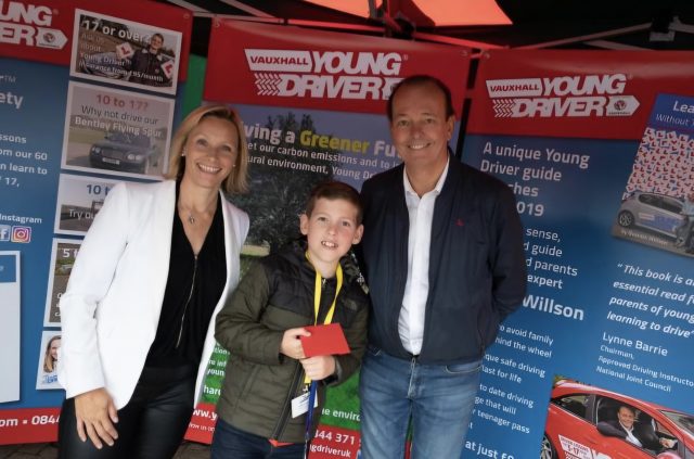 11-year-old Elliott accepts Young Driver award from TV's Vicky Butler-Henderson and Quentin Willson