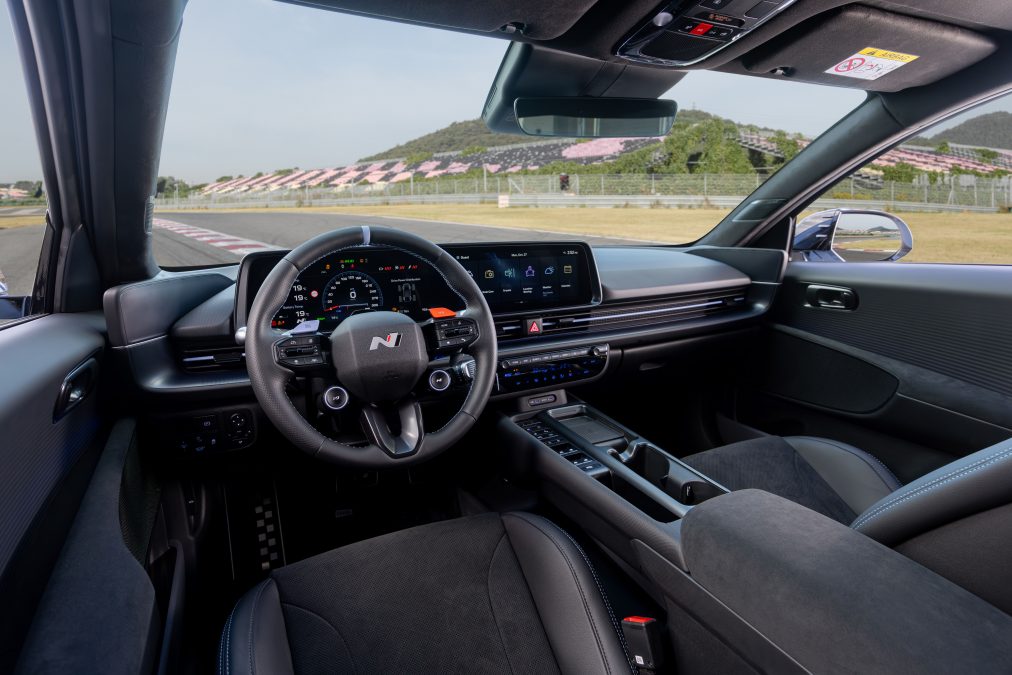 Inside, the cabin is optimised for high-performance driving. A black monochrome colourway with Performance Blue accents sets the tone, complemented by bucket seats upholstered in Alcantara suede and genuine leather for optimal support during spirited driving.